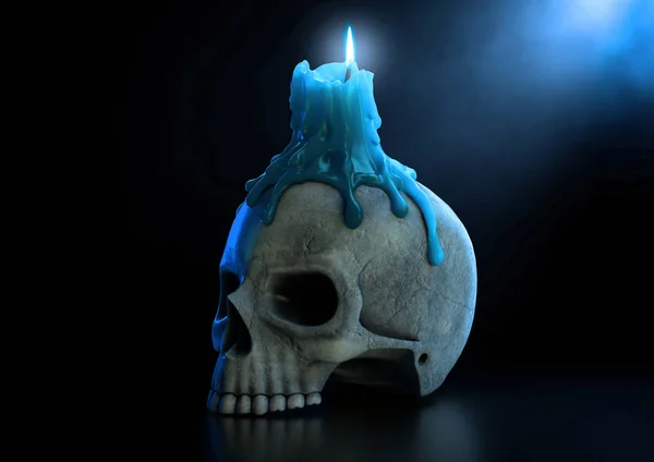 Свеча черепа и голубое пламя — стоковое фото