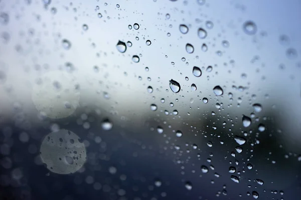 Abstract blurred Rain while the car is in the middle of the road