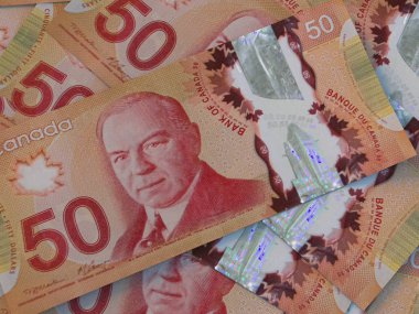 CAD. Canadian currency background. Closeup photo. Dollars of Can clipart