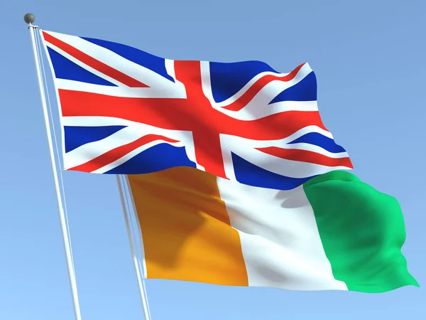 Two Waving State Flags United Kingdom Ivory Coast Blue Sky — Stock Photo, Image
