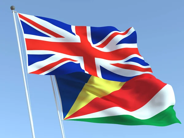 Duas Bandeiras Reino Unido Das Seicheles Céu Azul Alta Fundo — Fotografia de Stock