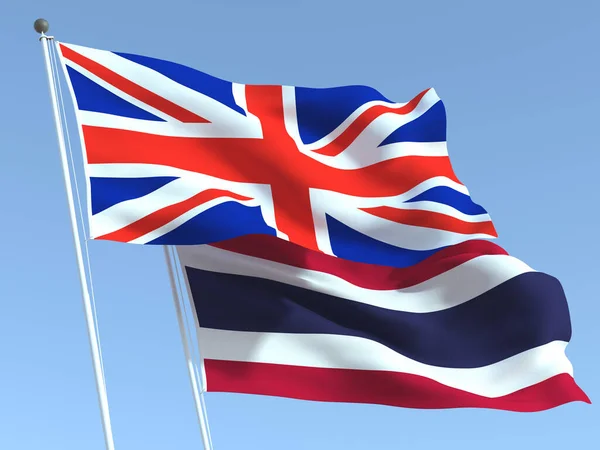 Dvě Vlající Státní Vlajky Spojeného Království Thajska Modré Obloze Vysoce — Stock fotografie