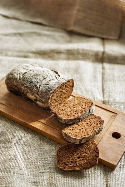 Sliced rustic dark food balance on the wooden desk at the table