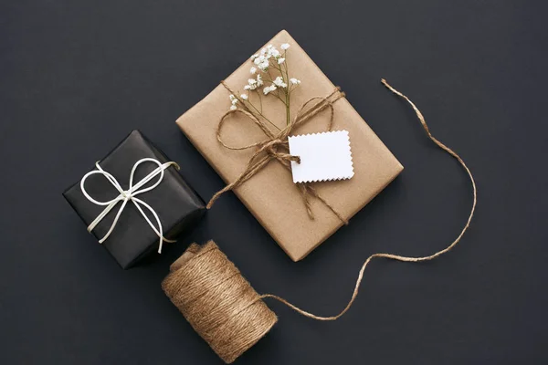 Gift Wrapping Process In Recycled Paper Gift Boxes Skein Of Twine