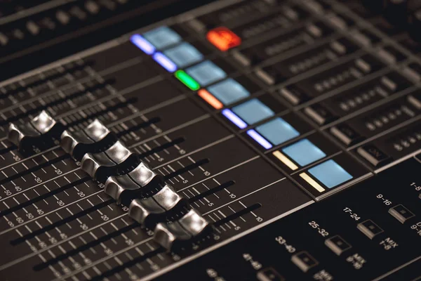 Professional studio equipment for sound mixing. Close-up view of audio control buttons