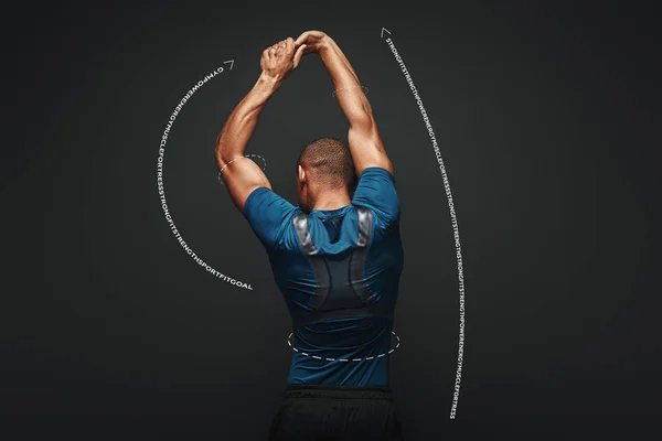 Hard work will solve your problems. Sportsman is stretching standing over dark background. Graphic drawing.
