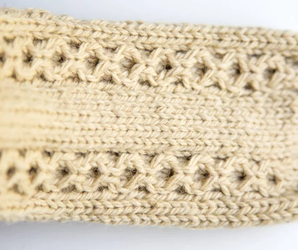 A beautiful closeup of a warm knitted pattern. Natural sheep wool yarn. Handcraft in bright colors.