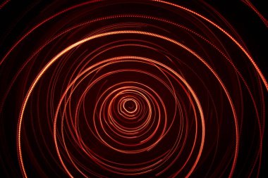 Kırmızı renk bir güzel, parlak ışık girdap. Siyah bir zemin üzerine fütüristik ışık boyama. Yuvarlak açık daireler