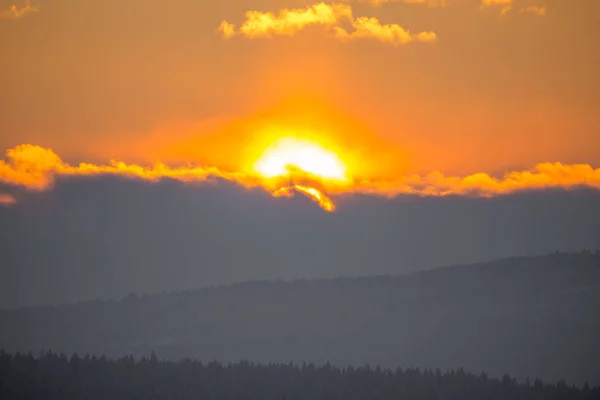 A beatiful sunset landscape of a small Norwegian ton Roros. WInter scenery with an evening sun. Warm, relaxing atmosphere.