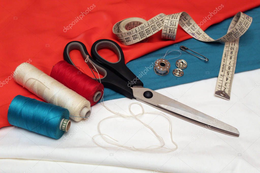 sewing supplies and three fabric 