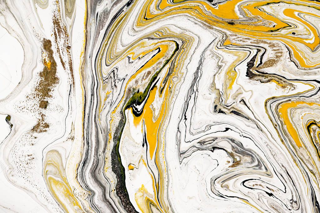Mixture of acrylic paints. Modern artwork. Yellow and black mixed acrylic paints. Liquid marble texture. Applicable for design packaging, labels, business cards, and interactive web backgrounds.