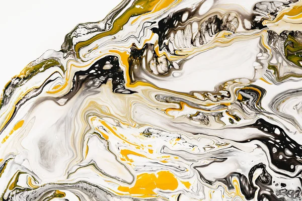 Mixture of acrylic paints. Modern artwork. Yellow and black mixed acrylic paints. Liquid marble texture. Applicable for design packaging, labels, business cards, and interactive web backgrounds.