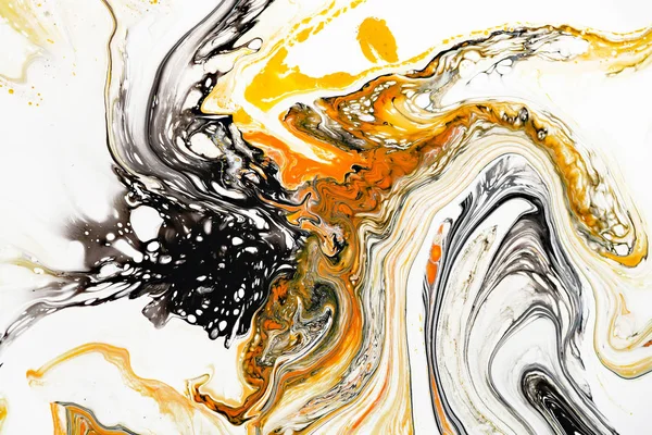 Mixture of acrylic paints. Modern artwork. Yellow and black mixed acrylic paints. Liquid marble texture. Applicable for design packaging, labels, business cards, and interactive web backgrounds.