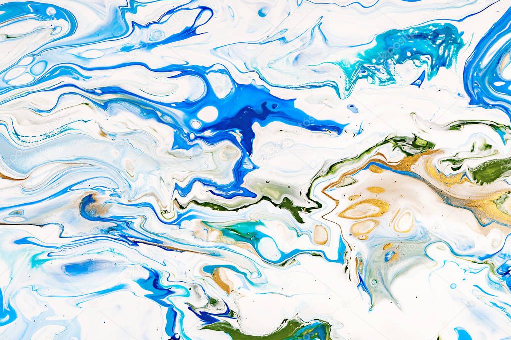 Hand painted background with mixed liquid blue, white, yellow paints. Abstract fluid acrylic painting. Modern art. Applicable for packaging, invitation, textile, wallpaper, design of different surfaces.