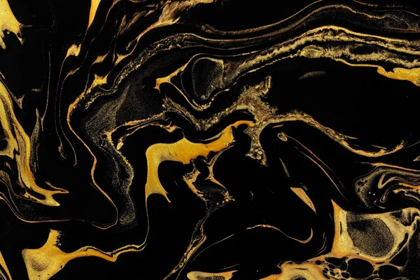 Black and gold marble texture design for packaging, cover, brochure, poster, wallpaper, presentation, invitation, textile, decor. Abstract modern background. Liquid acrylic painting. Fluid art