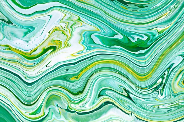 Fluid art texture. Background with abstract iridescent paint effect. Liquid acrylic picture with trendy mixed paints. Can be used for website background. Green, blue and yellow overflowing colors.