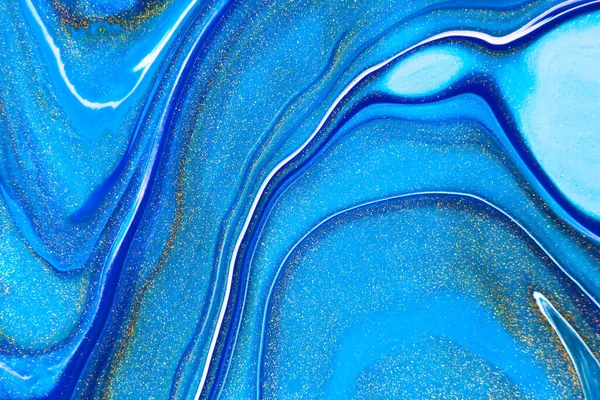 Fluid art texture. Abstract background with mixing paint effect. Liquid acrylic picture with flows and splashes. Mixed paints for background or poster. Navy blue, golden and azure overflowing colors.