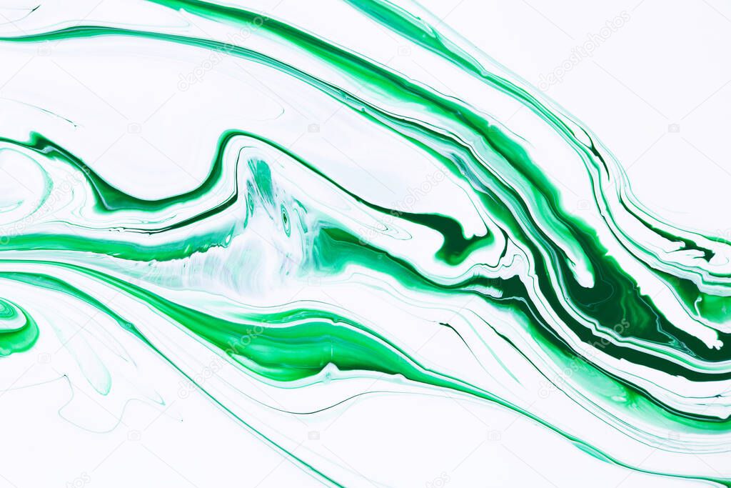 Fluid art texture. Background with abstract swirling paint effect. Liquid acrylic picture with trendy mixed paints. Can be used for website background. Green and white overflowing colors.