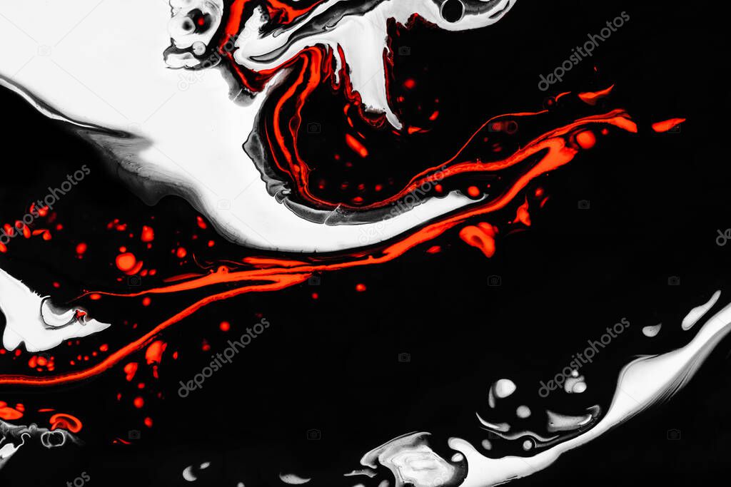 Fluid art texture. Background with abstract mixing paint effect. Liquid acrylic artwork with flows and splashes. Mixed paints for posters or wallpapers. Orange, black and white overflowing colors.