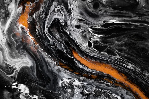 Fluid art texture. Abstract background with mixing paint effect. Liquid acrylic artwork with chaotic mixed paints. Can be used for posters or wallpapers. Black, golden and white overflowing colors.