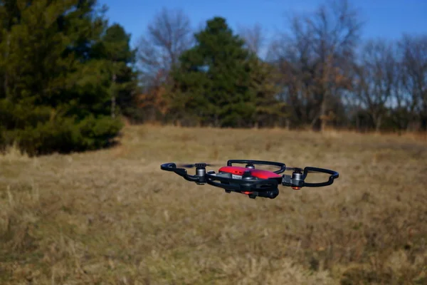 Drone in Flight gliding above last years tall grasses