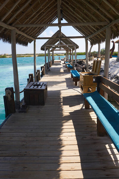  Thatched roofs on the boat dock on Renaissance Island in Aruba provide relief from the afternoon sun