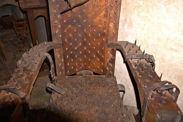 Also known as the Judas Chair, the Chair of Torture was a terrible device of the Middle Ages. They all have one thing in common: spikes cover the back, arm-rests, seat, leg-rests and foot-rests.