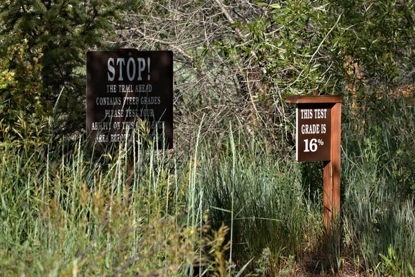 Trail sign alerting to the grade ahead on the trail