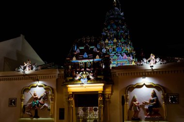Arulmigu Sri Mahamariamman hinduism temple on Penang island in Malaysia. Sacral architecture at night. clipart