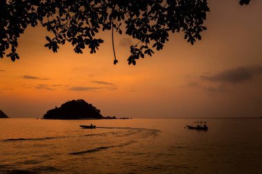 Teluk Nipah coral beach on Pangkor island in Malaysia. Beautiful landscape with sea  taken during golden sunset in south east Asia. clipart