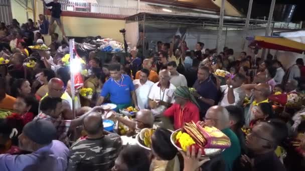 Committee break the coconut for devotees offering to deity. — Stock Video