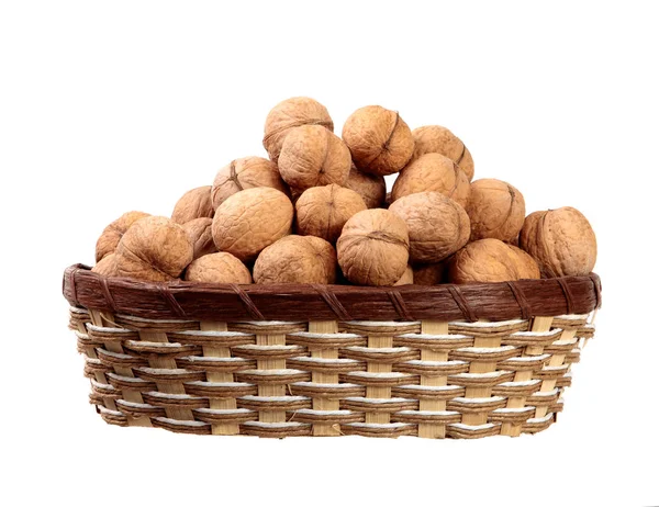 Inshell walnuts in a basket on an isolated white background. — Stock Photo, Image