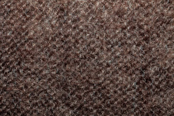 Texture of wool fibers, gray-brown background, abstraction. Spac