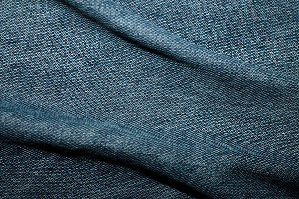 Textura denim azul com curvas, fundo, abstração. Têxtil — Fotografia de Stock