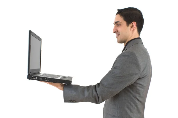 Młody biznesmen na laptopie — Zdjęcie stockowe