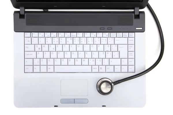 Stethoscope on laptop — Stock Photo, Image