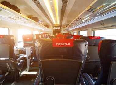 Milan, Italy - July 15, 2018: Interior of Italo train, it is the brand with which the private company promotes its high-speed services clipart