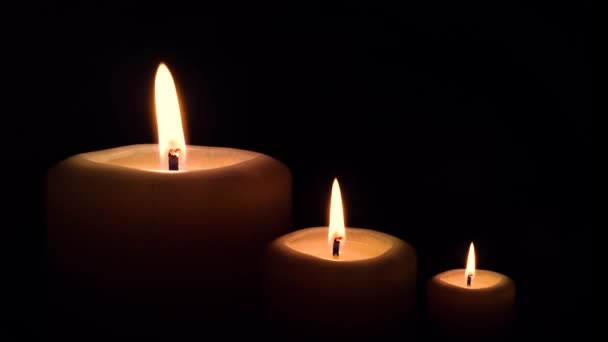 Three Burning Candle Flame Black Background — Stock Video