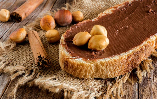 Slice Bread Chocolate Spread Hazelnuts Peeled Cinnamon — Stock Photo, Image