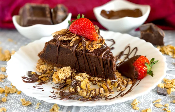 Slice of chocolate cake with muesli — Stock Photo, Image