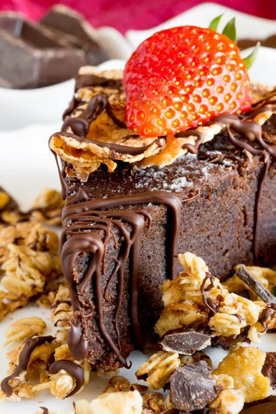 Slice of chocolate cake with muesli — Stock Photo, Image