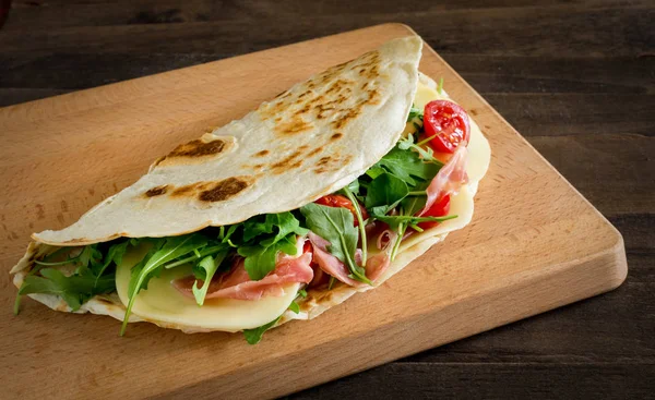 Romagna piadina filledon  chopping board — Stock Photo, Image