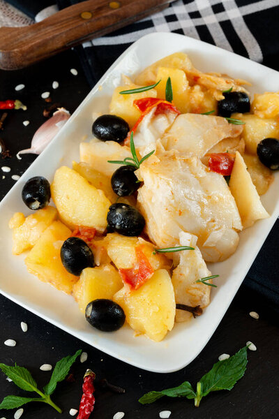 top view of Baked Codfish baccala Recipe with Potatoes and Olives