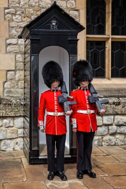 Pair of Guardsmen in Bearskin hats taken at the Tower of London, London, UK on 8 July 2017 clipart