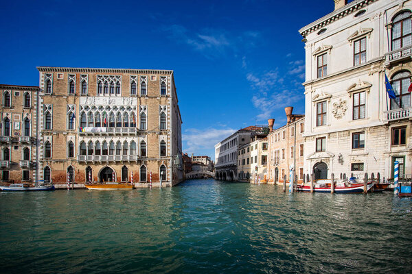 View of Grand Canal and side Canal and bridge in Venice, Italy on 27 November 2018