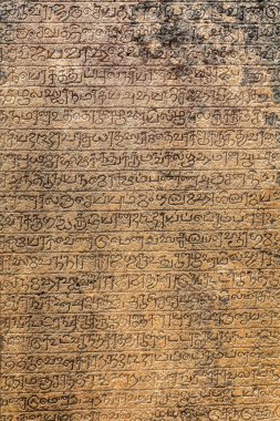 Ancient sanskrit writing on tablet - close up in Polonnaruwa, Sri Lanka on 18 September 2016 clipart