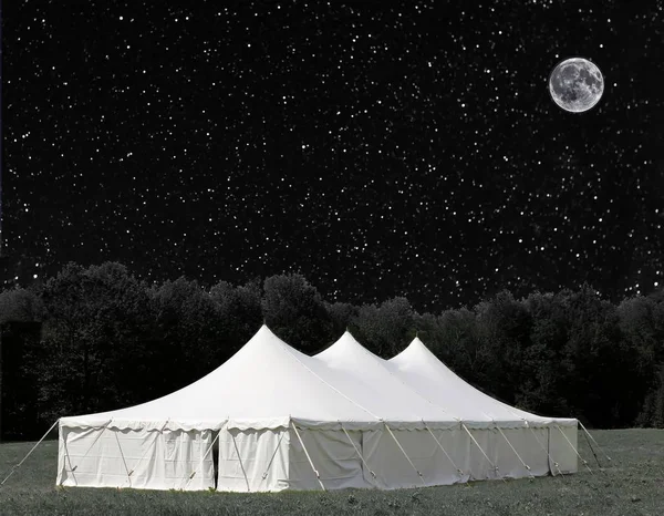 white events tent under a star filled sky (some elements courtesy of nasa)