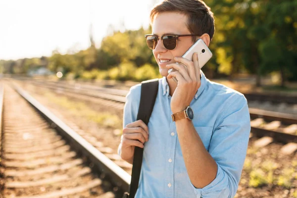 Beautiful Stylish Guy Glasses Posing Train Rails Sunset Talking Phone — Stock Photo, Image