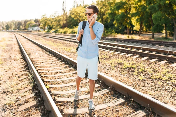 Beautiful Stylish Guy Glasses Posing Train Rails Sunset Talking Phone — Stock Photo, Image