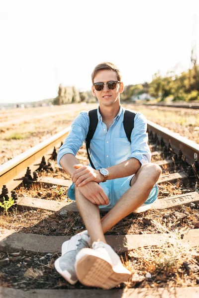 Beautiful Stylish Guy Glasses Posing Sitting Rails Train Sunset Hipster — Stock Photo, Image